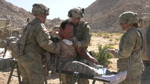 Combat medics practice battlefield medical simulations during training exercises