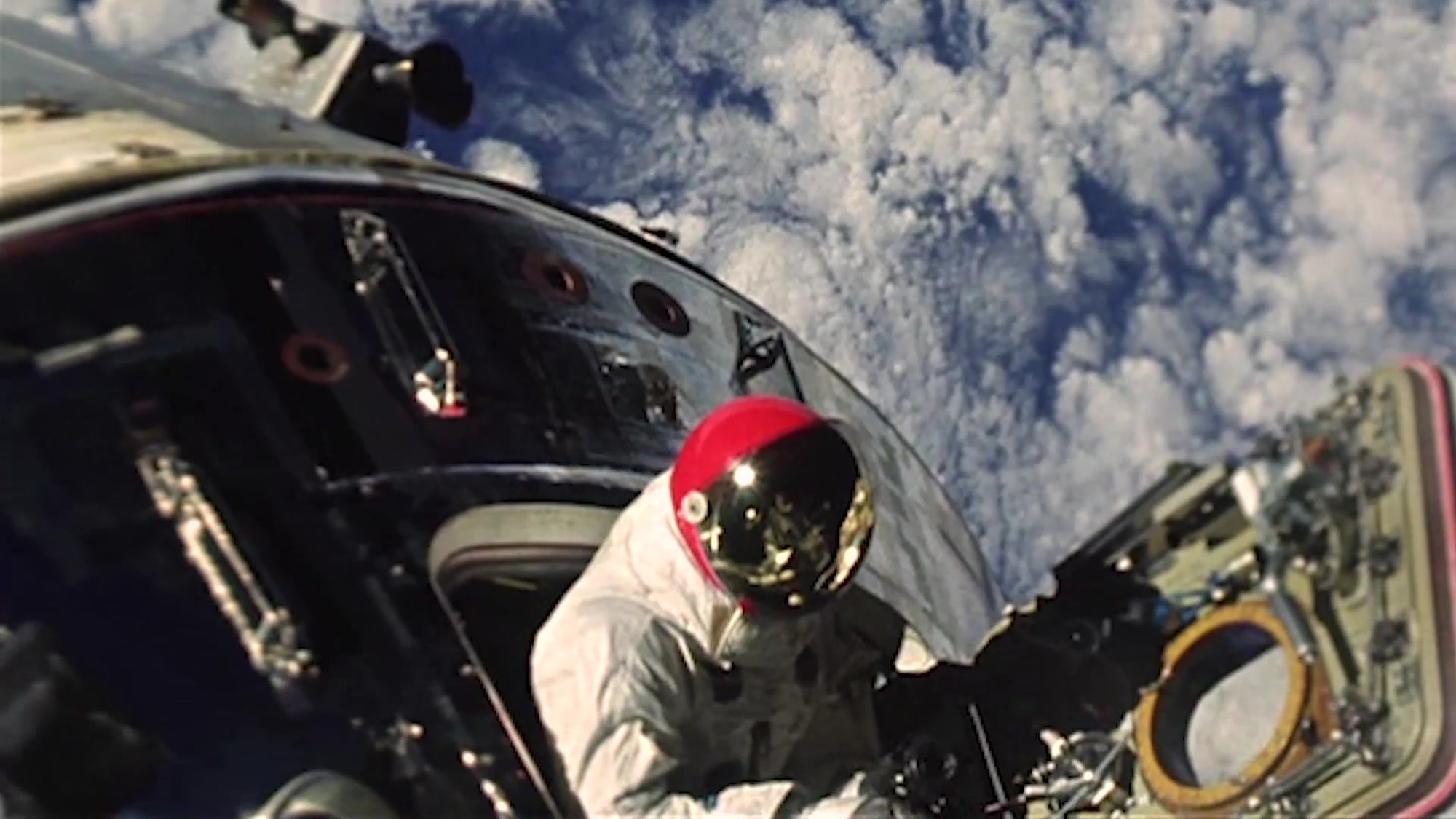 An astronauts flies outside of a ship in space orbit. 