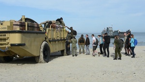 Local and International Media Embark on a Landing Craft Utility