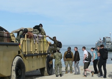 Local and International Media Embark on a Landing Craft Utility