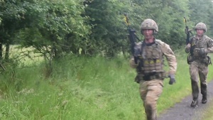 British Royal marines practice section attack scenarios and helicopter-based fast-roping drills