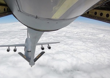 KC-135 Performs Aerial Refuel With C-5