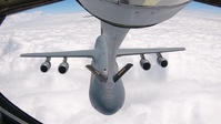 KC-135 Performs Aerial Refuel With C-5