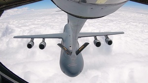 KC-135 Performs Aerial Refuel With C-5