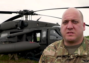 Army National Guard UH-60 Black hawk crew prepares for a flight to support the IRT