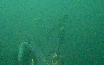 Deep-Water Diver Fits a Pumping System to Recover Oil from the Coimbra Shipwreck