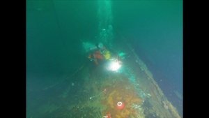 Coimbra Response Diver Installs Secured Valve Caps at a Depth of 180 Feet