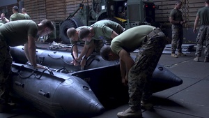 Golf Company Marines build boats at sea (B-Roll)