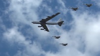 U.S. B-52 and Colombian Kfir fighters fly in formation during F-AIR Colombia