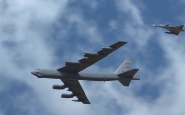 U.S. B-52 and Colombian Kfir fighters fly in formation during F-AIR Colombia