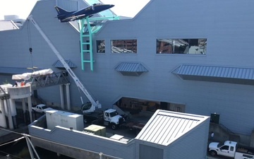 Vietnam War Era Sampan is craned and delivered to Naval Museum