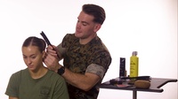 Male Marines attempt to form sock buns