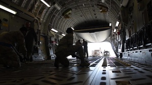 60th APS Airmen load Wright-Patterson C-17