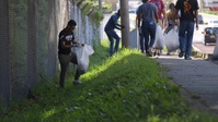 Members of the U.S. and local community clean up around Uruma City