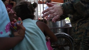 U.S. Navy Sailors, Philippine Airmen, and Philippine Marines take part in a cooperative health engagement activity during KAMANDAG 3