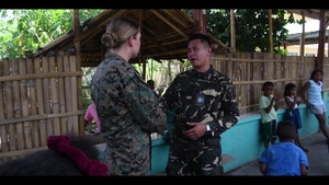 U.S. Navy Sailors, Philippine Airmen, and Philippine Marines take part in a cooperative health engagement activity during KAMANDAG 3