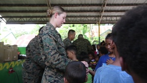 U.S. Navy Sailors, Philippine Airmen, and Philippine Marines take part in a cooperative health engagement activity during KAMANDAG 3