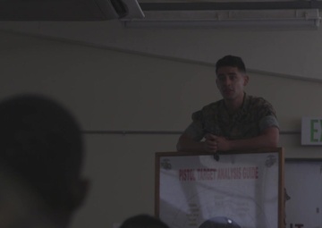 Aspiring U.S. Marine Corps Combat Marksmanship Coaches recieve pistol marksmanship classes