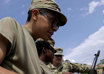 U.S. Army Reserve Soldier with the 392nd Expeditionary Signal Battalion types on a keyboard during Communications Exercise