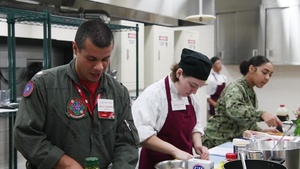 VFA-102 Sailors, MC Perry High School students team up to cook