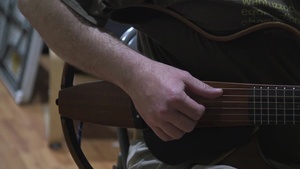 103rd ESC Soldier Volunteers at American Red Cross as a Guitar Instructor