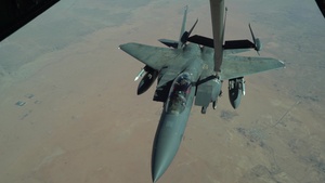 908th Expeditionary Air Refueling Squadron refuels F-15Es