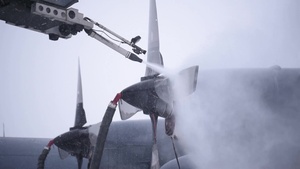 C-130 De-Icing and Snow Removal on Flight Line (B-Roll)