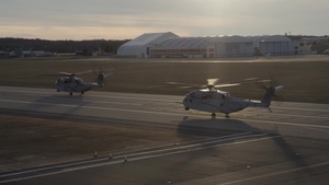 Two CH-53K King Stallions lift off during formation test flight