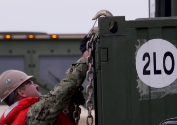 U.S Marines and Sailors unload heavy equipment off the Improved Navy Lighterage System at MPFEX20