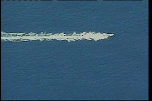 Coast Guard HITRON aircrew engages a suspected smuggling vessel in the Eastern Pacific Ocean
