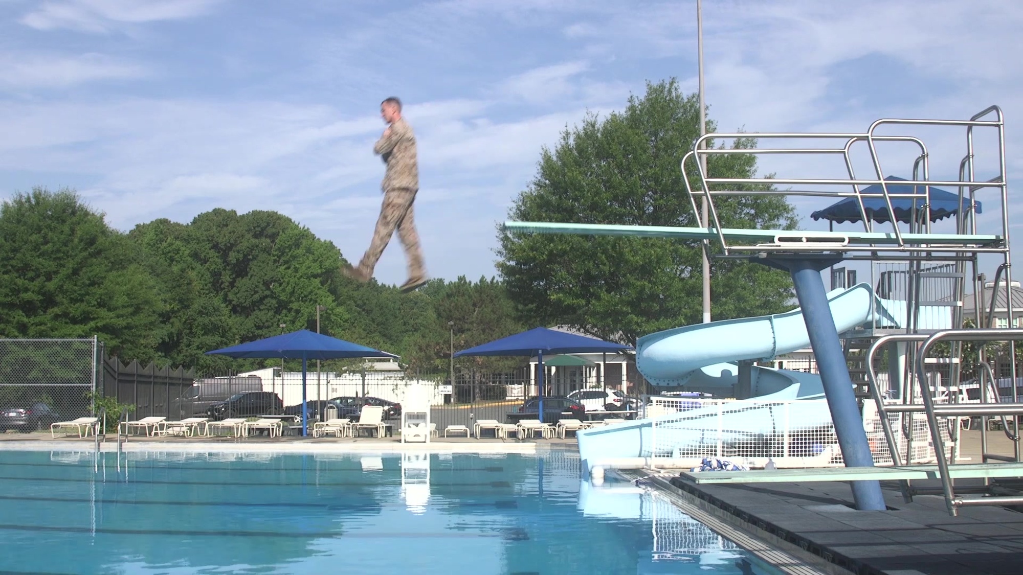Given an aquatic environment with deep water, while wearing a combat utility uniform.
- Enter the water from a platform.
- Orient to surface.
- Clear a breathing space while surfacing.
- Orient to Safety. 
- Swim to safety utilizing one or a combination of the aquatic survival strokes.
- Exit the water.
