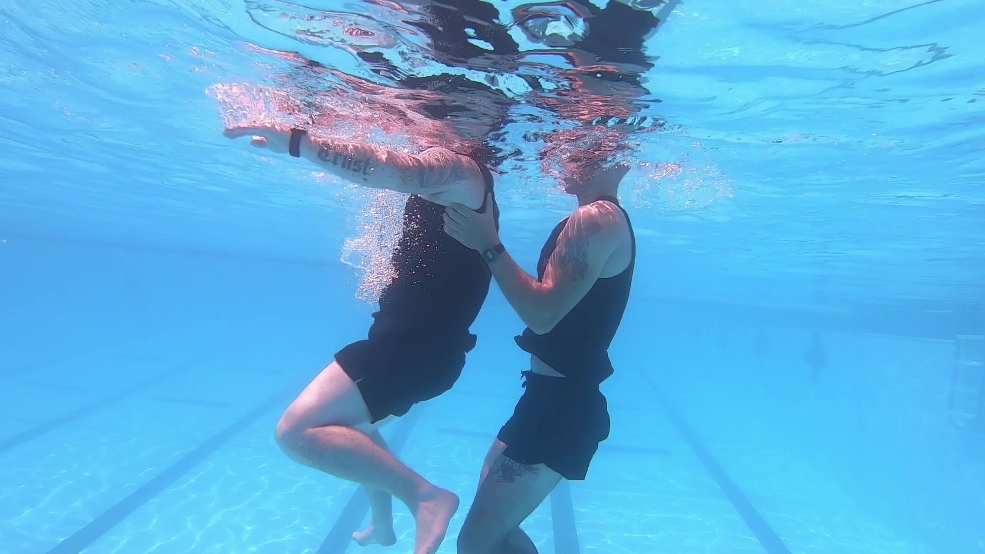 The double armpit tow is performed after a victim has been properly leveled-off. 
- If the time allows, remove the helmet and gear before attempting the rescue. To execute the double armpit tow, place both hands under the victim’s armpits. Once the victim is horizontal and on the water’s surface, begin rearward momentum by slowly extending the arms into a fully locked-out position and executing a double armpit tow and inverted breast stroke kick. kick must be continuous and vigorous in order to keep the victim’s face above the water.