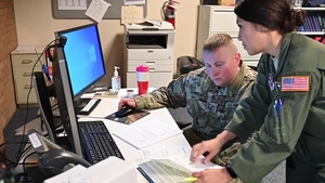 West Virginia National Guard members assist poison control center by manning phones