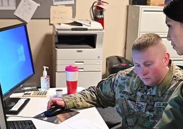 West Virginia National Guard members assist poison control center by manning phones