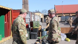 1ID Fwd Soldiers conduct container maintenance in Poland