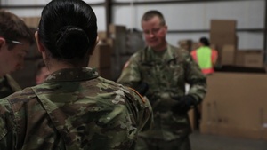 B-Roll: Soldiers unload and organize a shipment of personal protective equipment in a Wisconsin warehouse to prepare civilian healthcare workers and first responders for COVID-19.