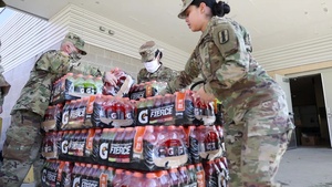 Rhode Island Guardsmen Unload Food Donated By USO