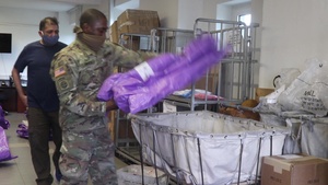 Soldiers assist Post Office workers to get mail to the U.S. Army Garrison Ansbach community.