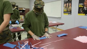 Aerial Delivery instructors, students make face coverings, surgical masks