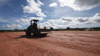 Sailor compacts create a level foundation at the site of the Expeditionary Medical Facility (EMF) being built