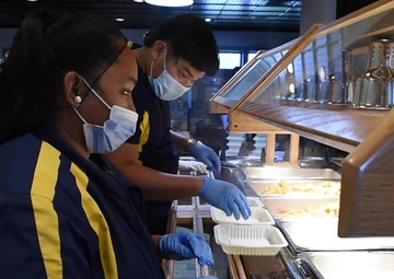 Morale Welfare and Recreational employees at Tomahawk and Torpedoes prepare meals in support of USS Theodore Roosevelt (CVN 71) Sailors