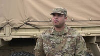 Soldiers hand out food in Chelsea