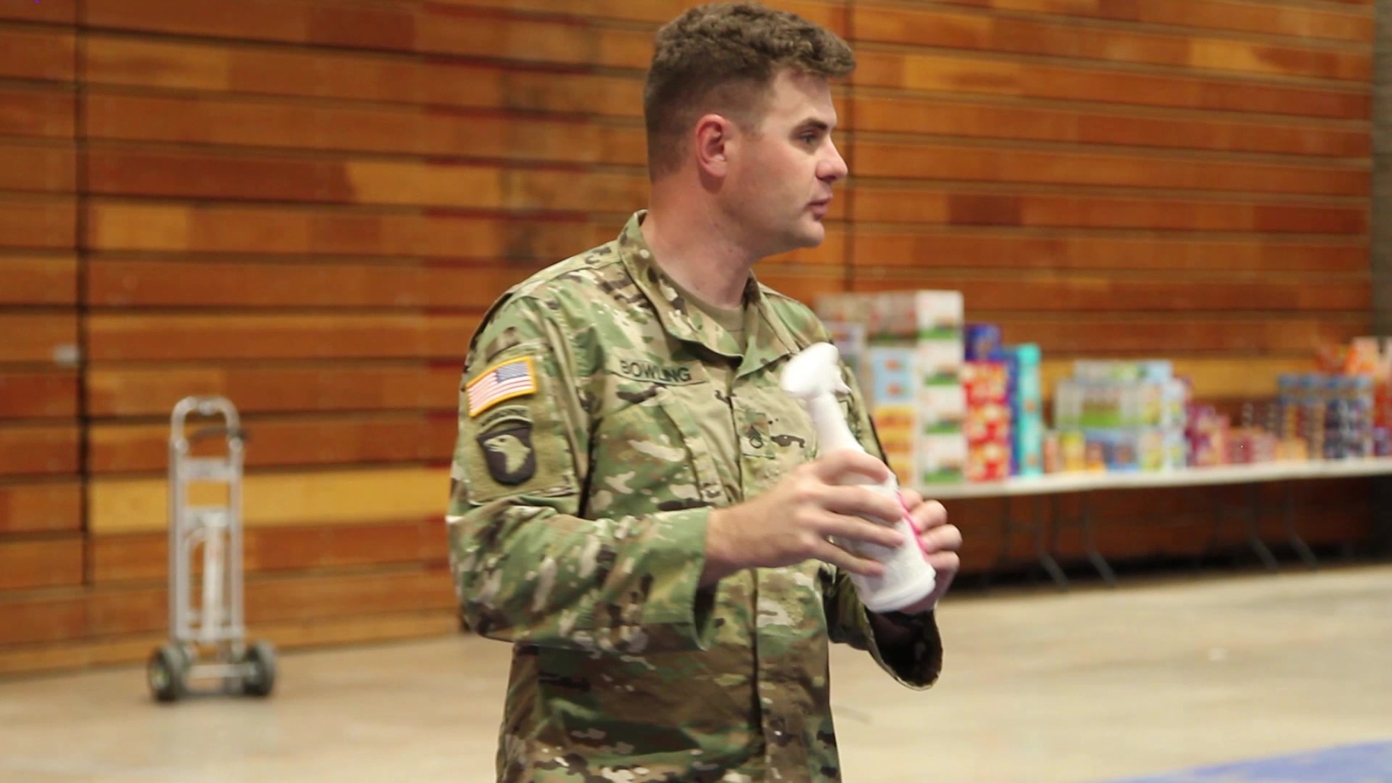 Medics with the Arizona Army National Guard instruct members and volunteers of the Hopi emergency operations center on the proper use of PPE at Hopi Veterans Memorial Center on April 22, 2020. The medics instruct on proper use of masks, eye protection, and gloves in different scenarios.