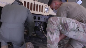 HIANG load C-17 with 8 HMMWV's in support of Covid-19 Response