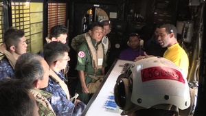 Commander, Expeditionary Strike Group 7 speaks while sailing in the South China Sea, April 26, 2020