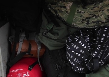 Sailors assigned to the aircraft carrier USS Theodore Roosevelt (CVN 71) depart a hotel for the ship