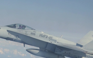 F/A-18C Hornets with VMFA-115 refuel with VMGR-152