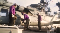 Marines and Sailors refuel aircraft aboard USS America