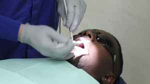 Dentists, Dental Techs Make House Call to Suwon AB