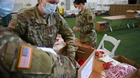 National Guard builds 350,000 testing kits in 2 days.